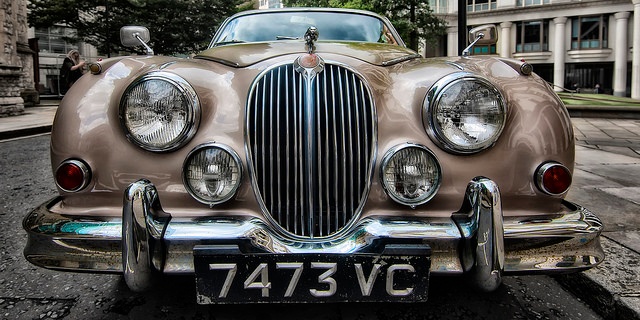 A classic luxury car with flawlessly maintained exterior paint and body A classic luxury car with flawlessly maintained exterior paint and body
