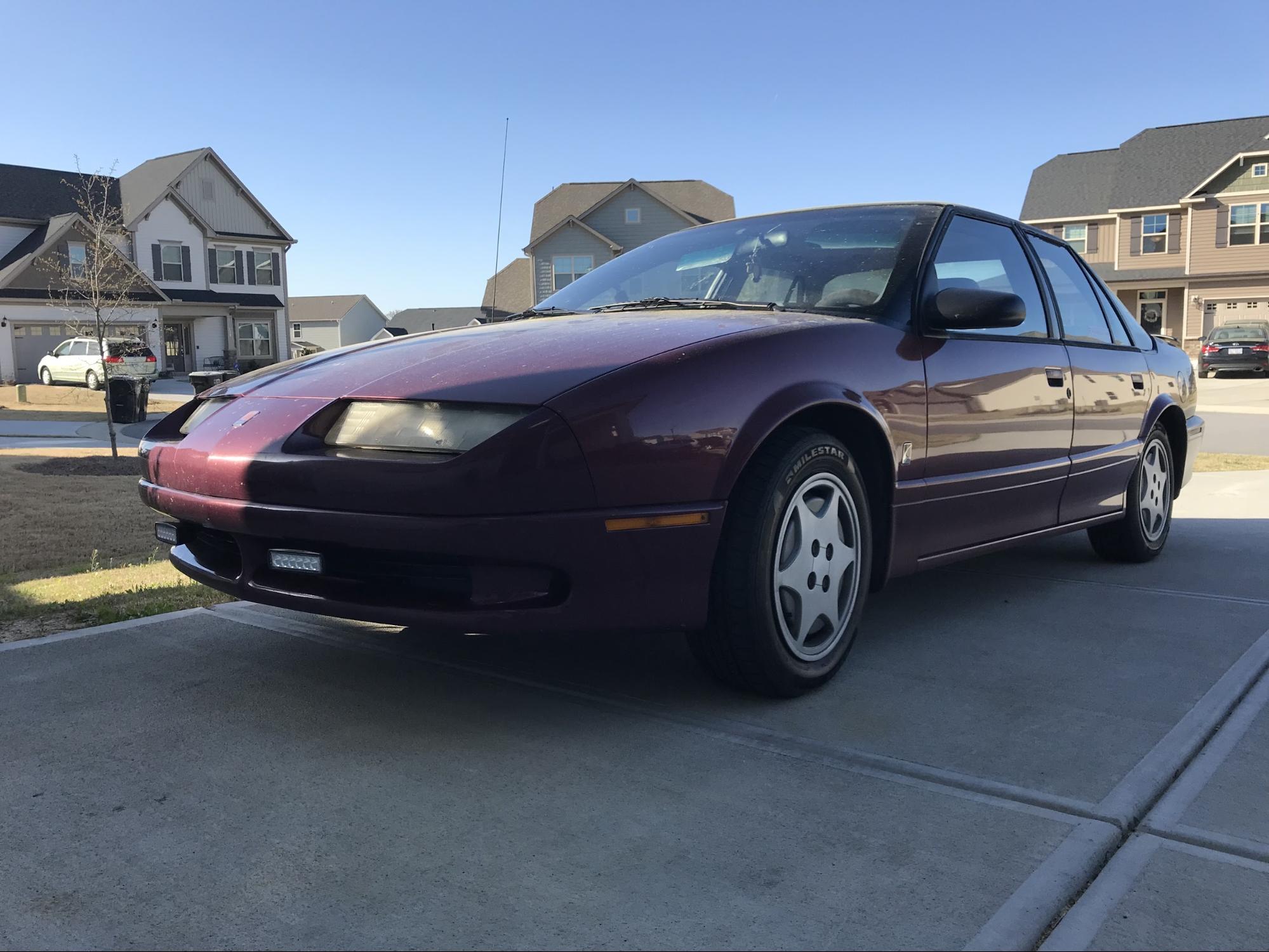 Pictured: 1994 Saturn SL2, total price: $800