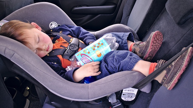 Baby sleeping peacefully in a car seat Baby sleeping peacefully in a car seat