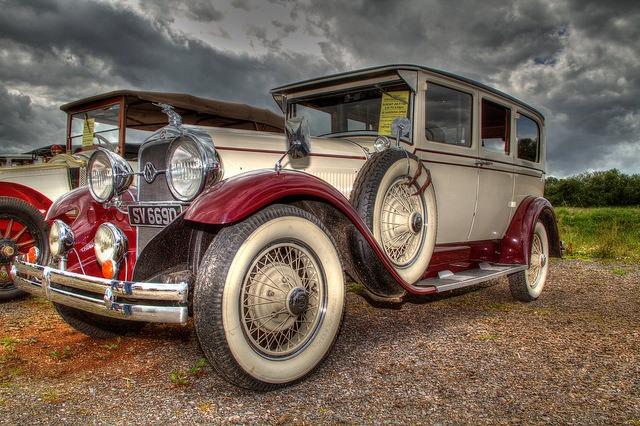 Car Talk vintage classic cars parked in field Car Talk vintage classic cars parked in field