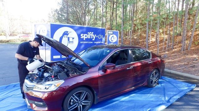 Oil Change being done by a Spiffy technician Oil Change being done by a Spiffy technician