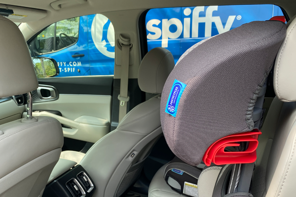 A clean car seat signals the end of a post road trip Spiffy service, returning the car’s interior to a showroom shine.