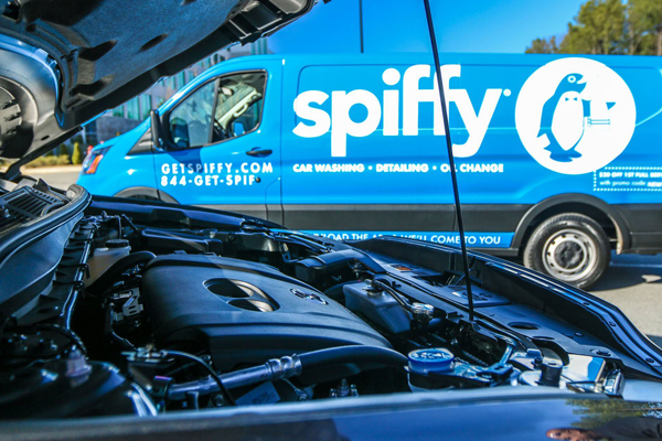 A Spiffy van sits ready to perform a mobile oil change after a customer’s long summer road trip.