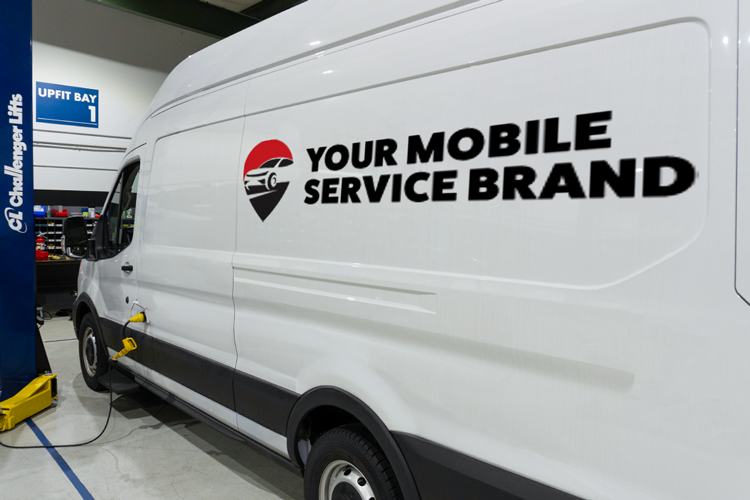 A white van inside Spiffy's van factory, highlighting the customizable exterior wrap options to match any brand's identity.